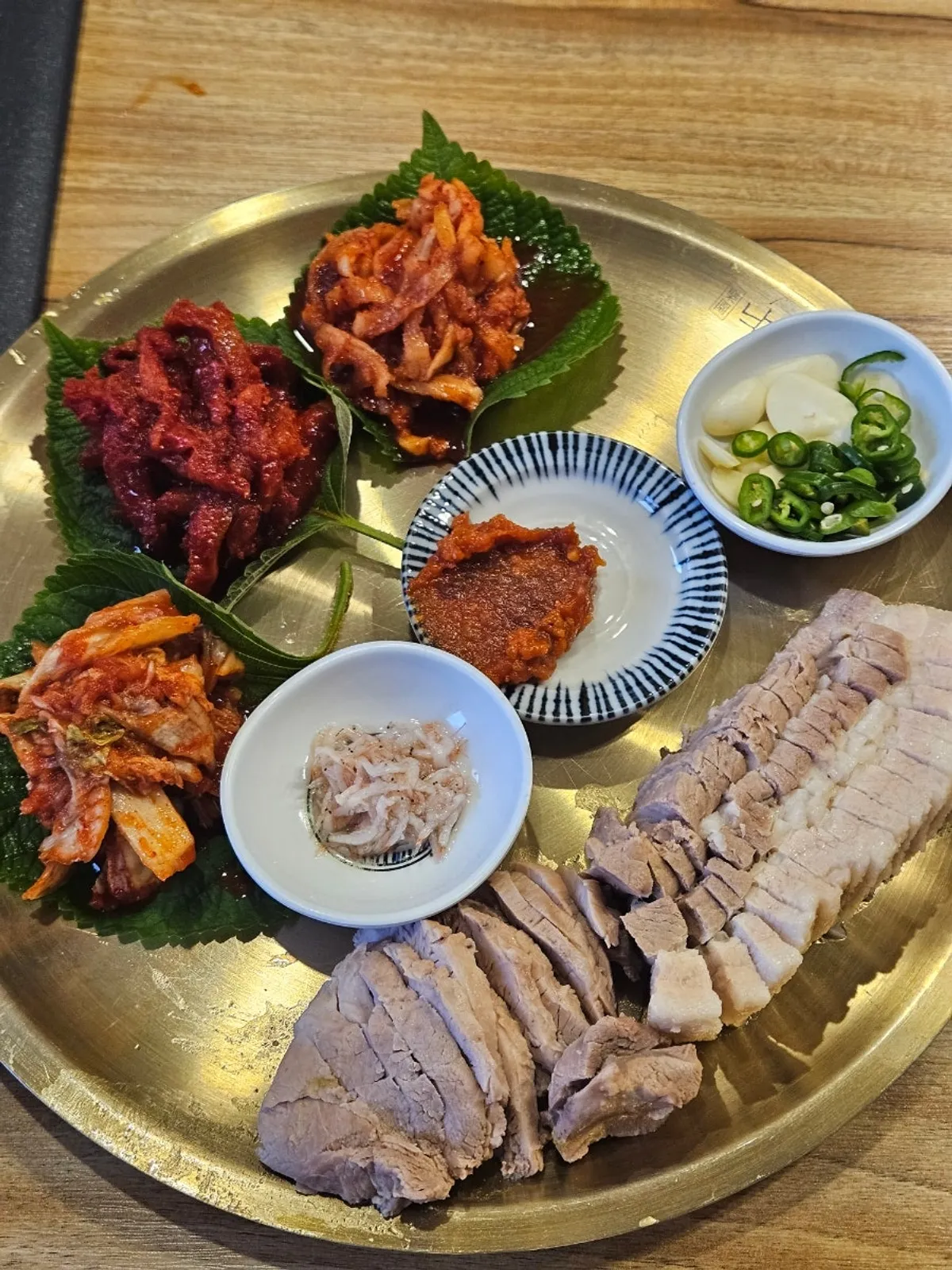 A spread with bossam so, jang kalguksu, and Jeonju-style soba together