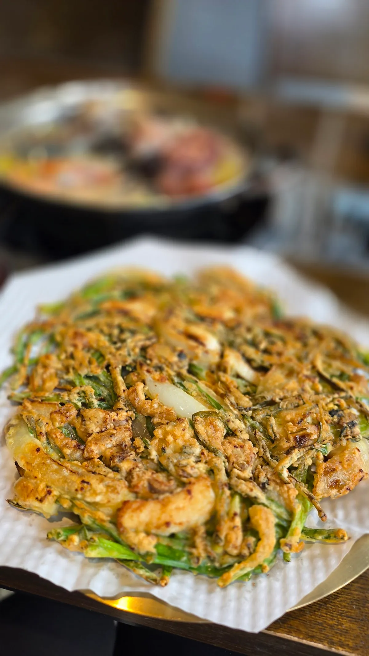 A pot of Choi Jiseong's Seafood Kalguksu filled with seafood