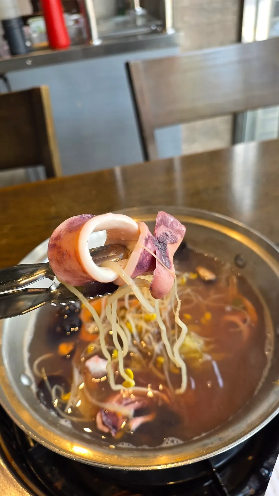 A plate of cooked squid and clams pulled from the pot