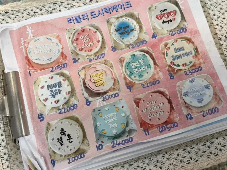 Display of lettering cake designs in the shop