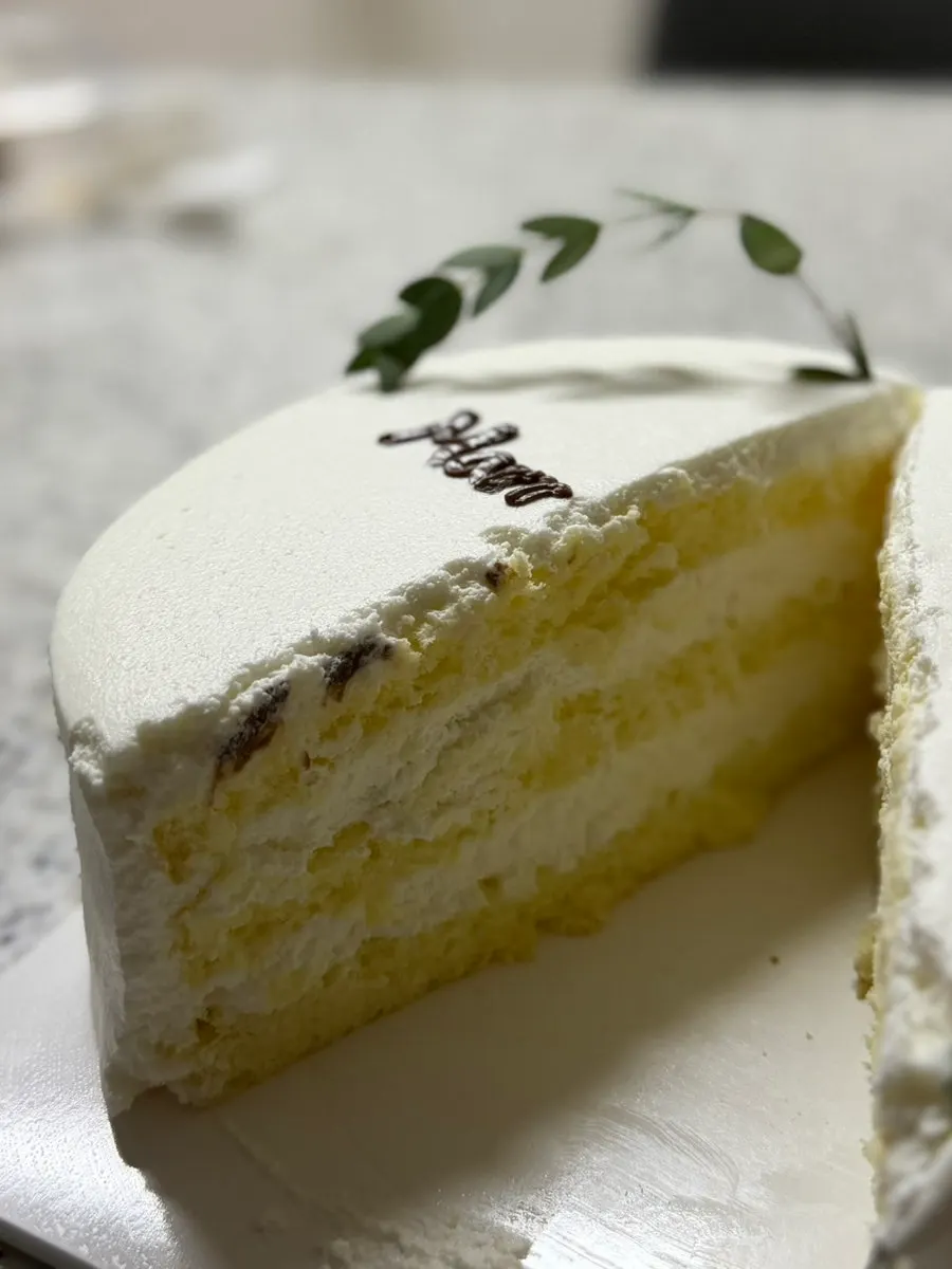 A cut slice of the milk flavor cake being eaten