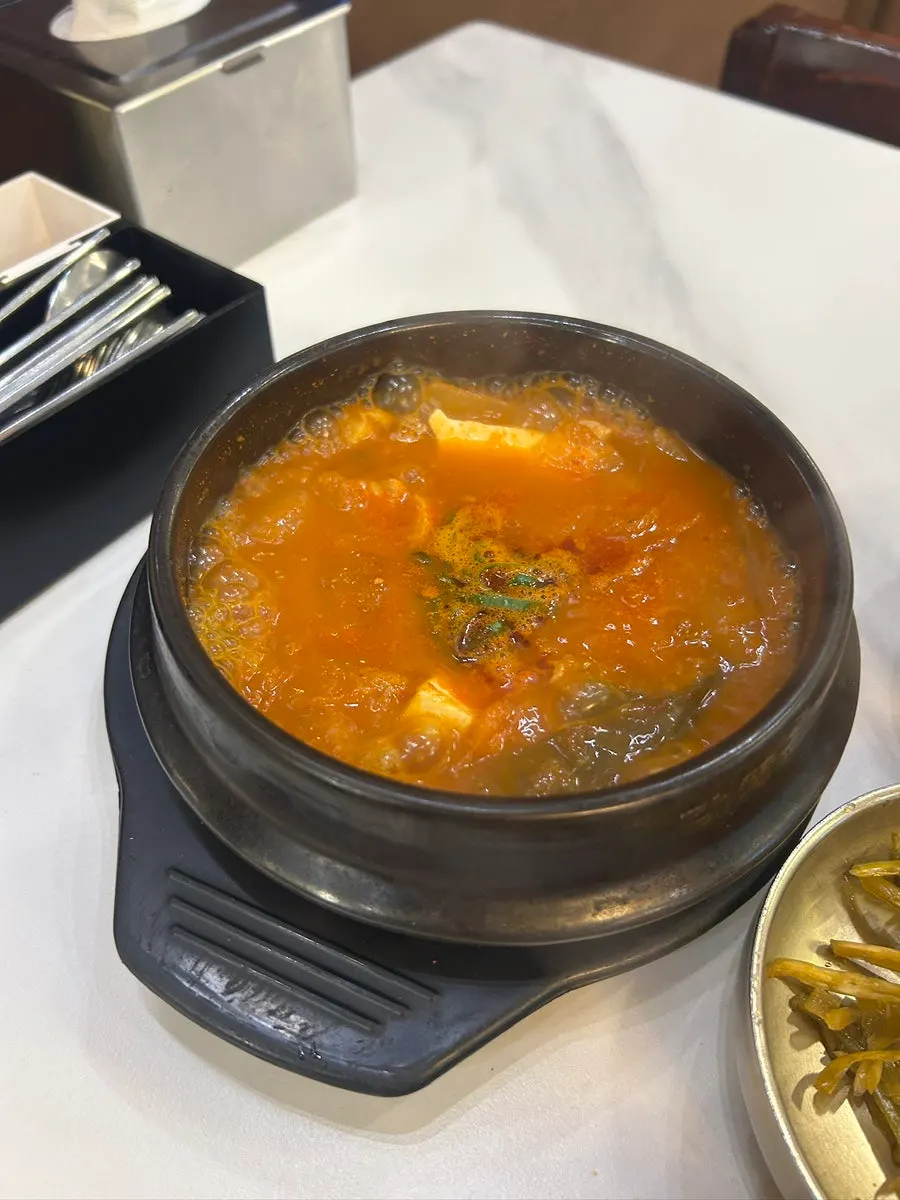 Complimentary kimchi jjigae served with the meal