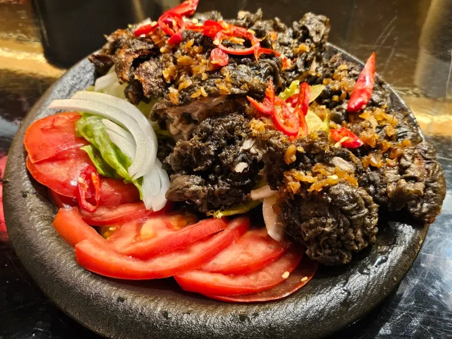 Yuringi on a stone platter with chili and garlic sauce