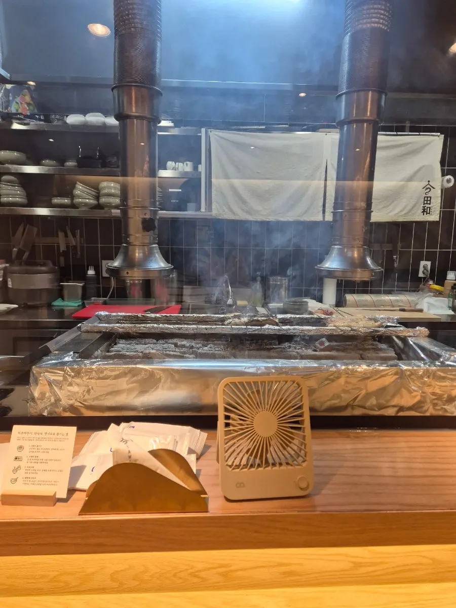 Eel being grilled over intense heat