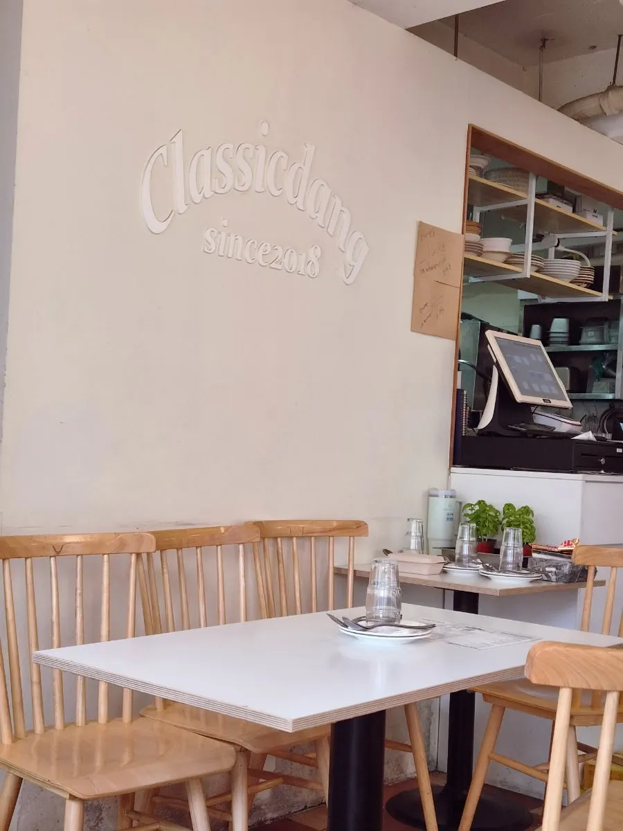 Classicdang's interior decorated with wood-tone furniture and lighting