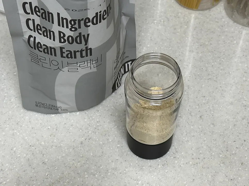 A finished cup of Black Bean shake mixed with water