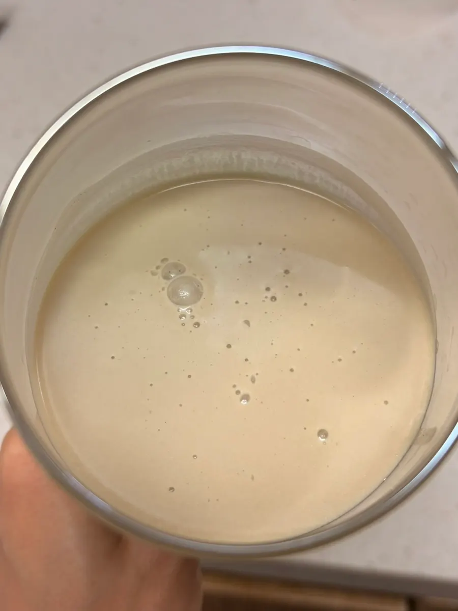 A glass of Cleanit Black Bean mixed with water