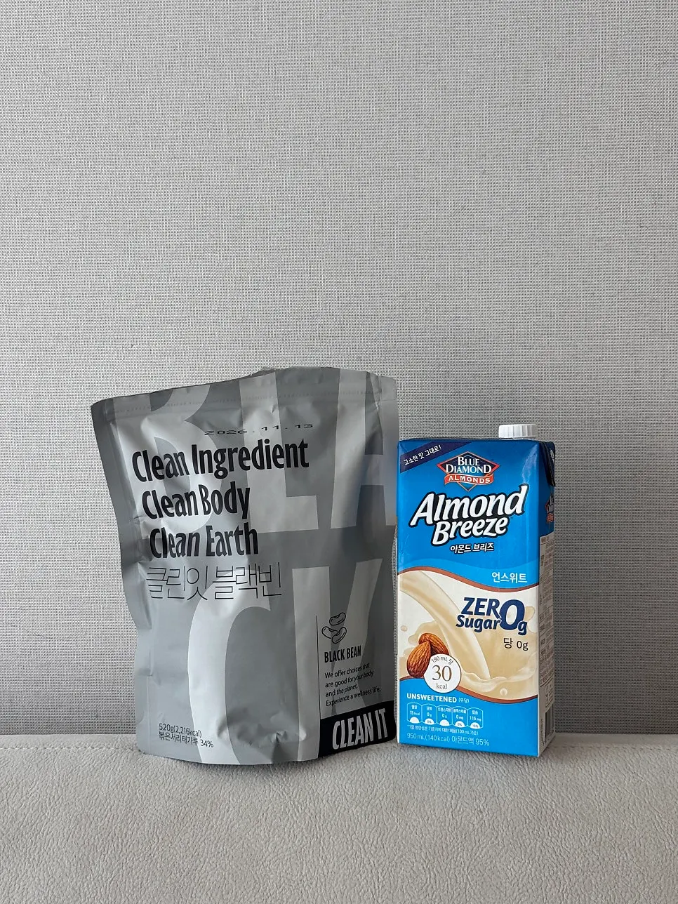 Cleanit Black Bean placed next to Almond Breeze