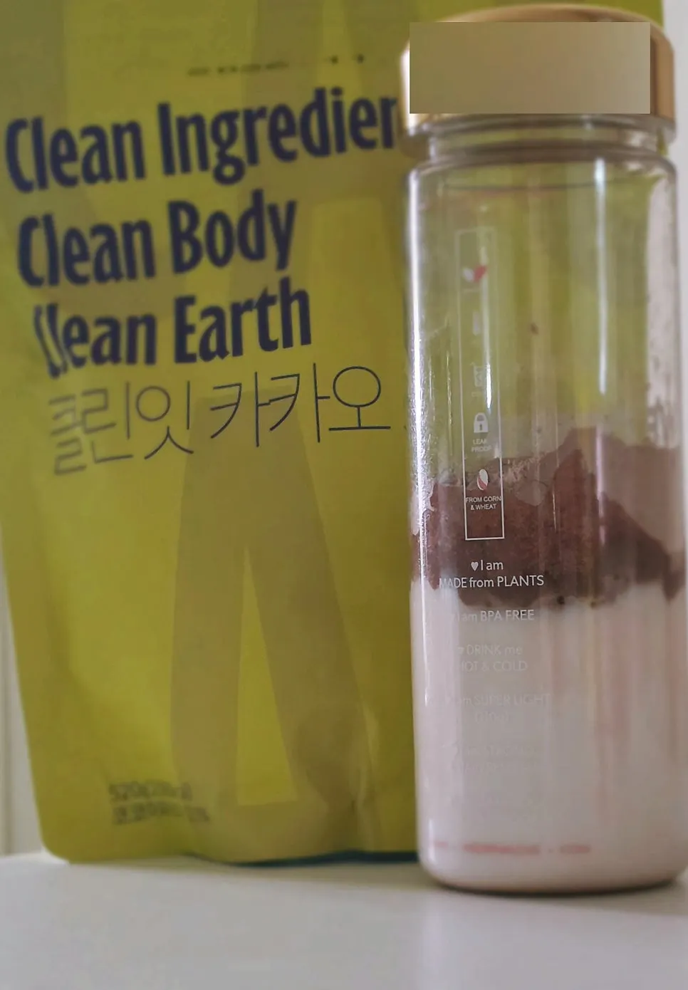Cold milk and protein powder added to a bottle
