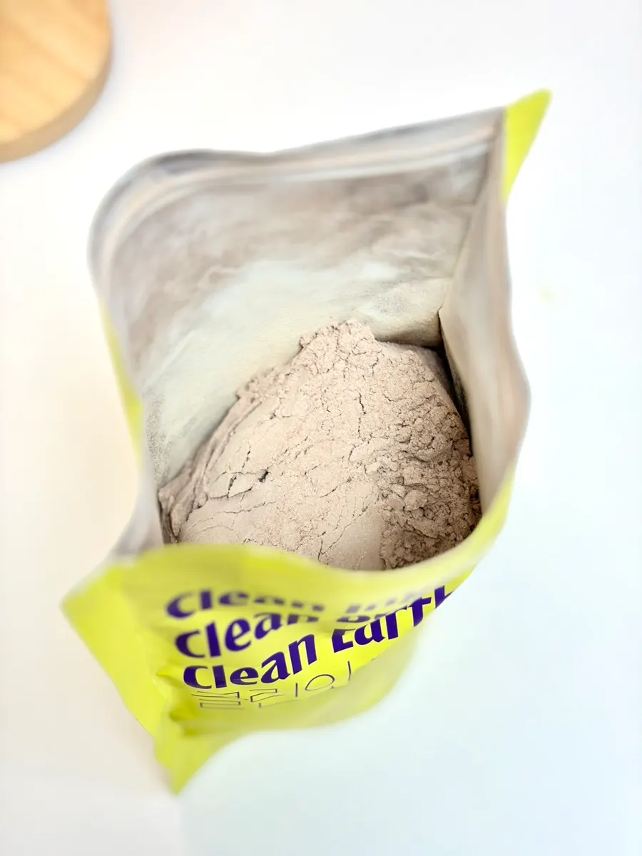 Cacao-flavored protein powder inside the opened pack