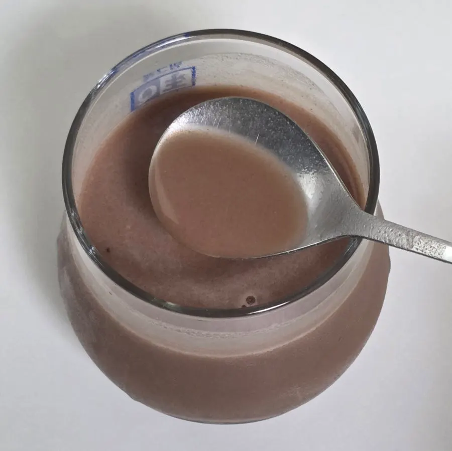 A strongly mixed plant-based chocolate protein shake