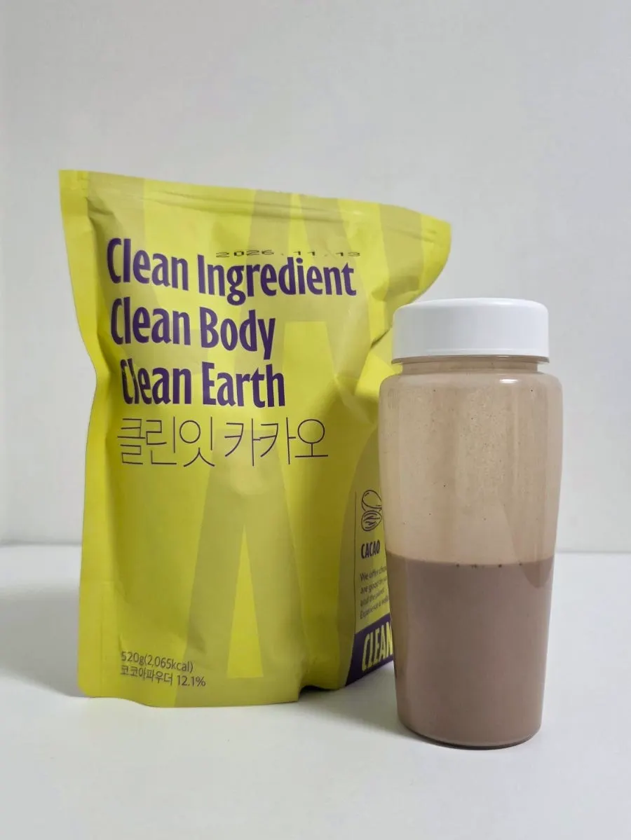 A glass of Cleanit Cacao protein made with low-sugar soy milk