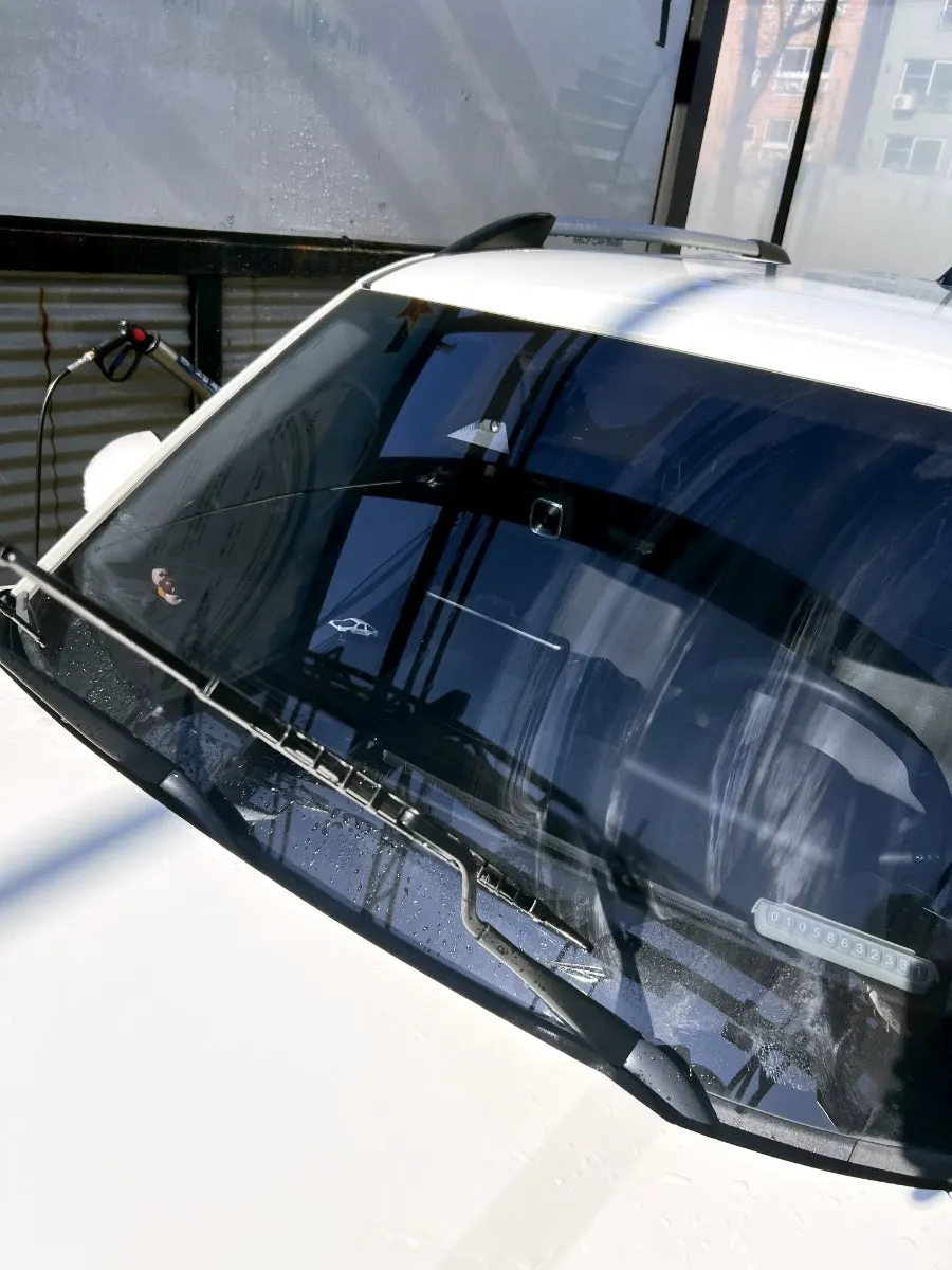Vehicle glass-care process of applying oil-film remover and buffing with a towel