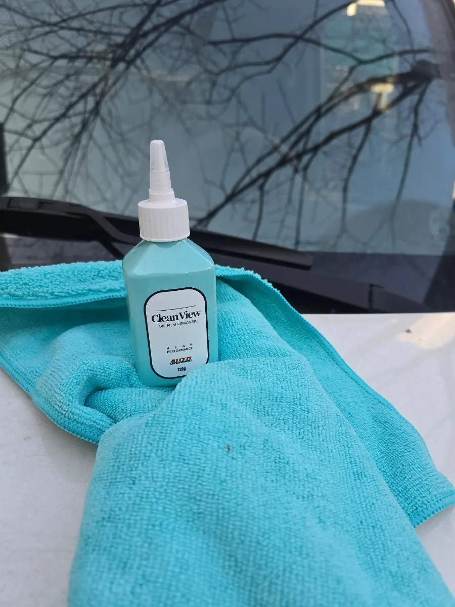 Glass-care process of applying CleanView and wiping with a towel
