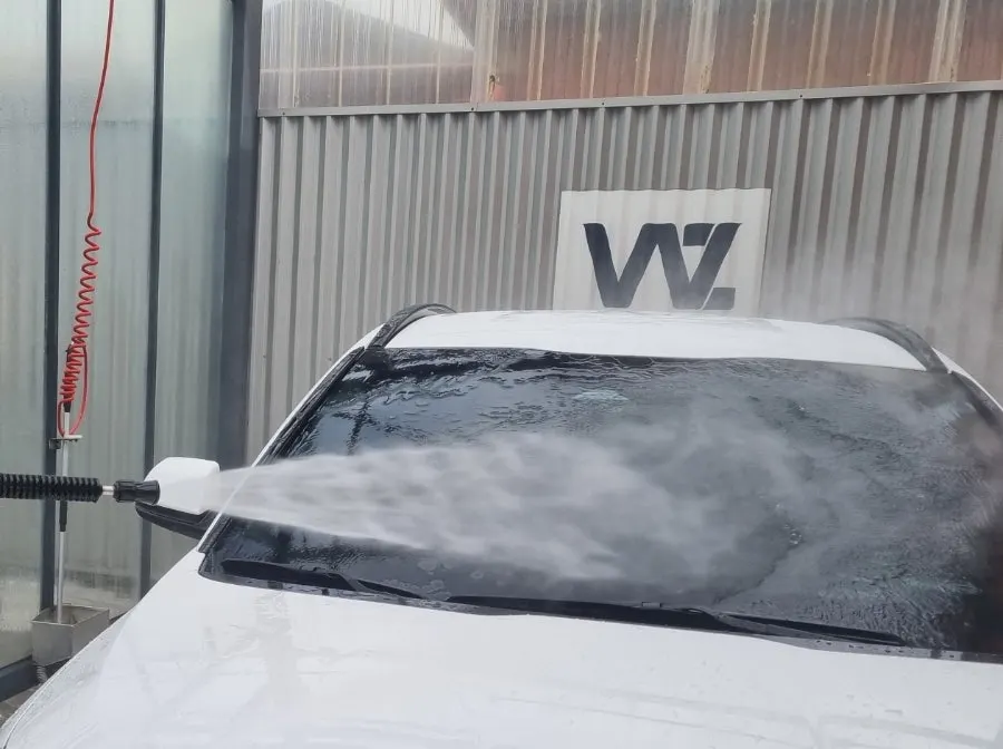 Wiping a windshield treated with oil-film remover using a towel