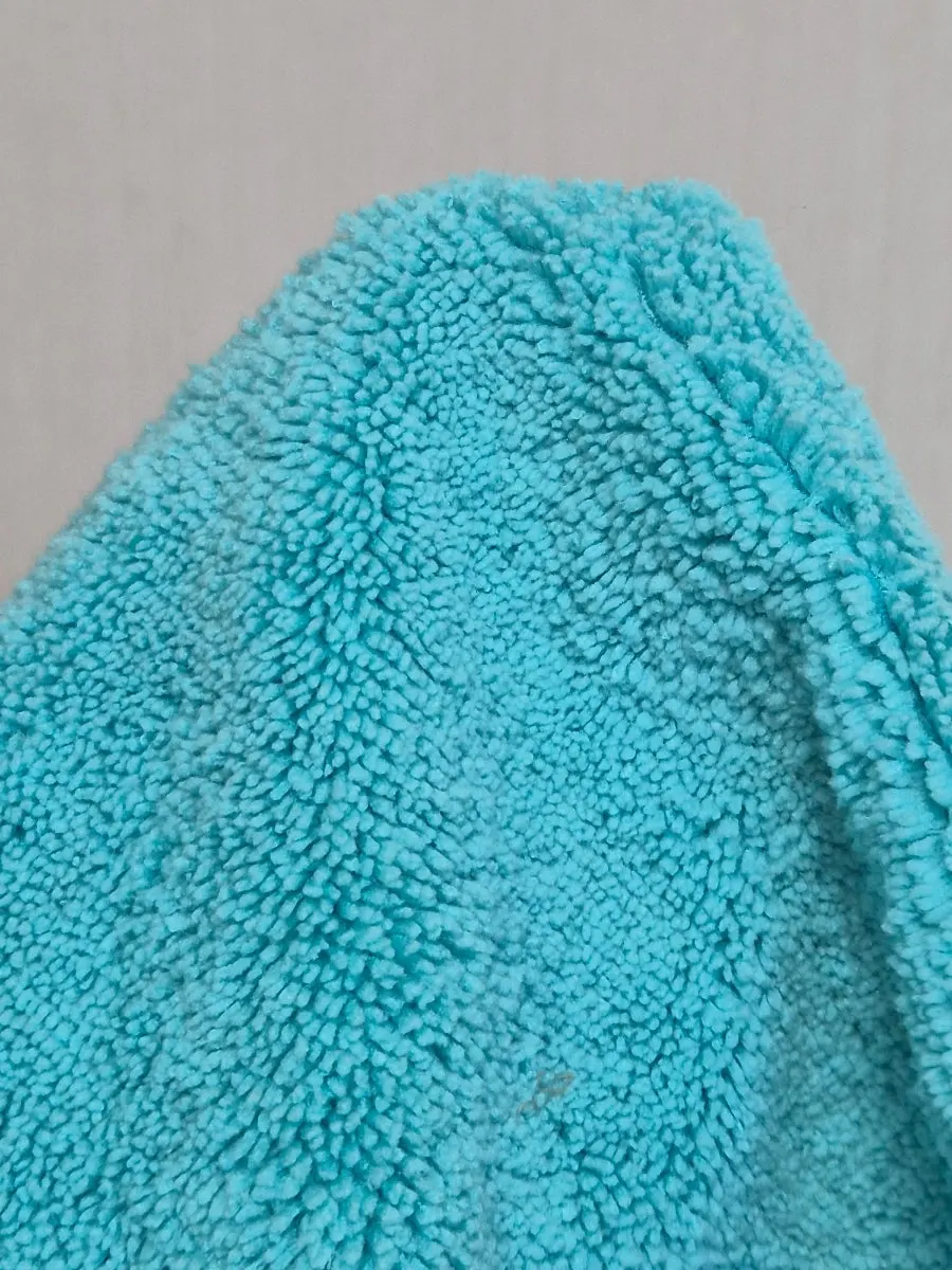 Oil film removal towel with different materials on each side