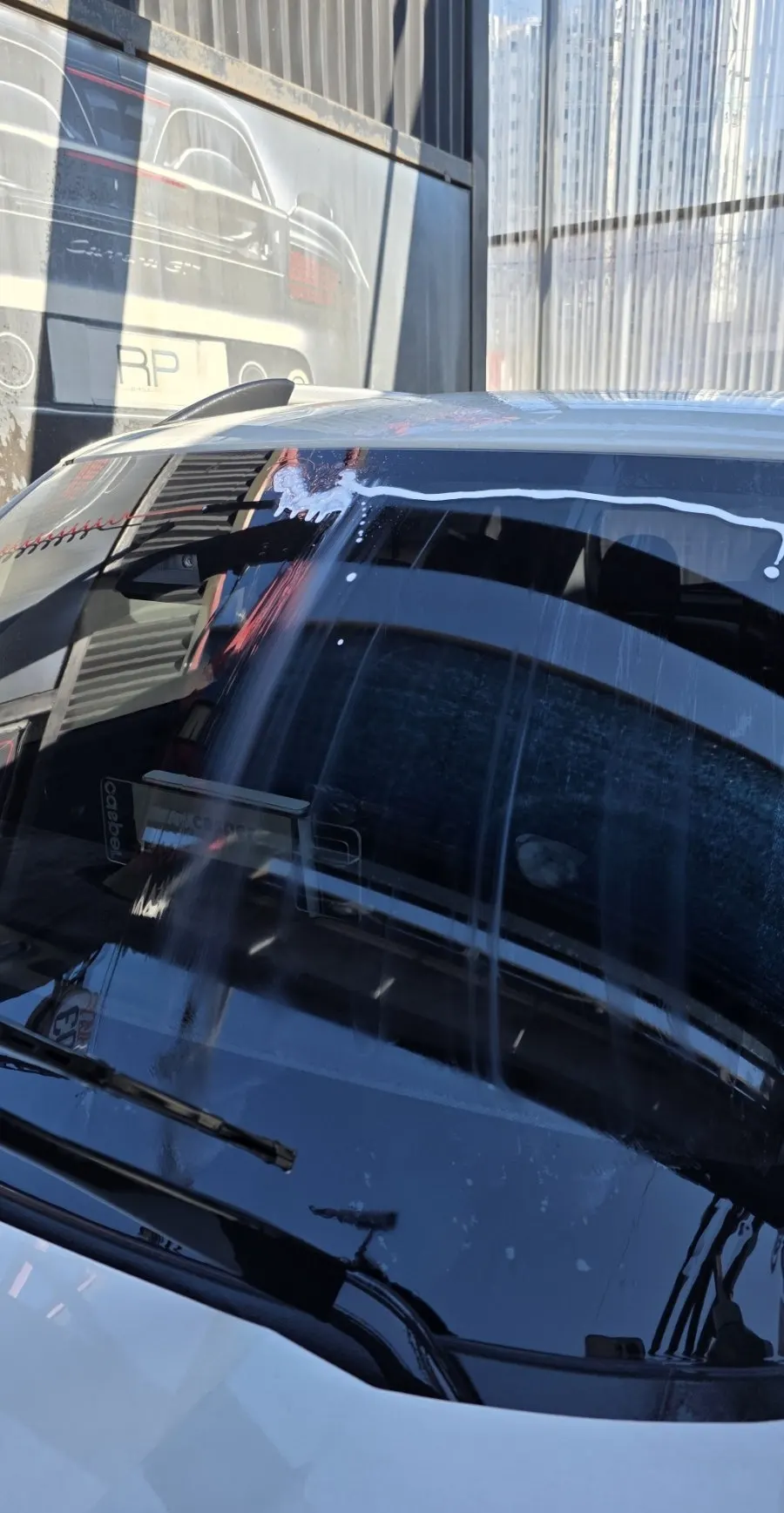 Preparing for oil film removal after washing away car grime