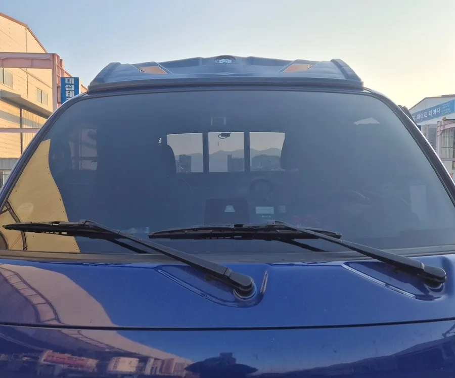 Car glass checked for visibility after oil film removal