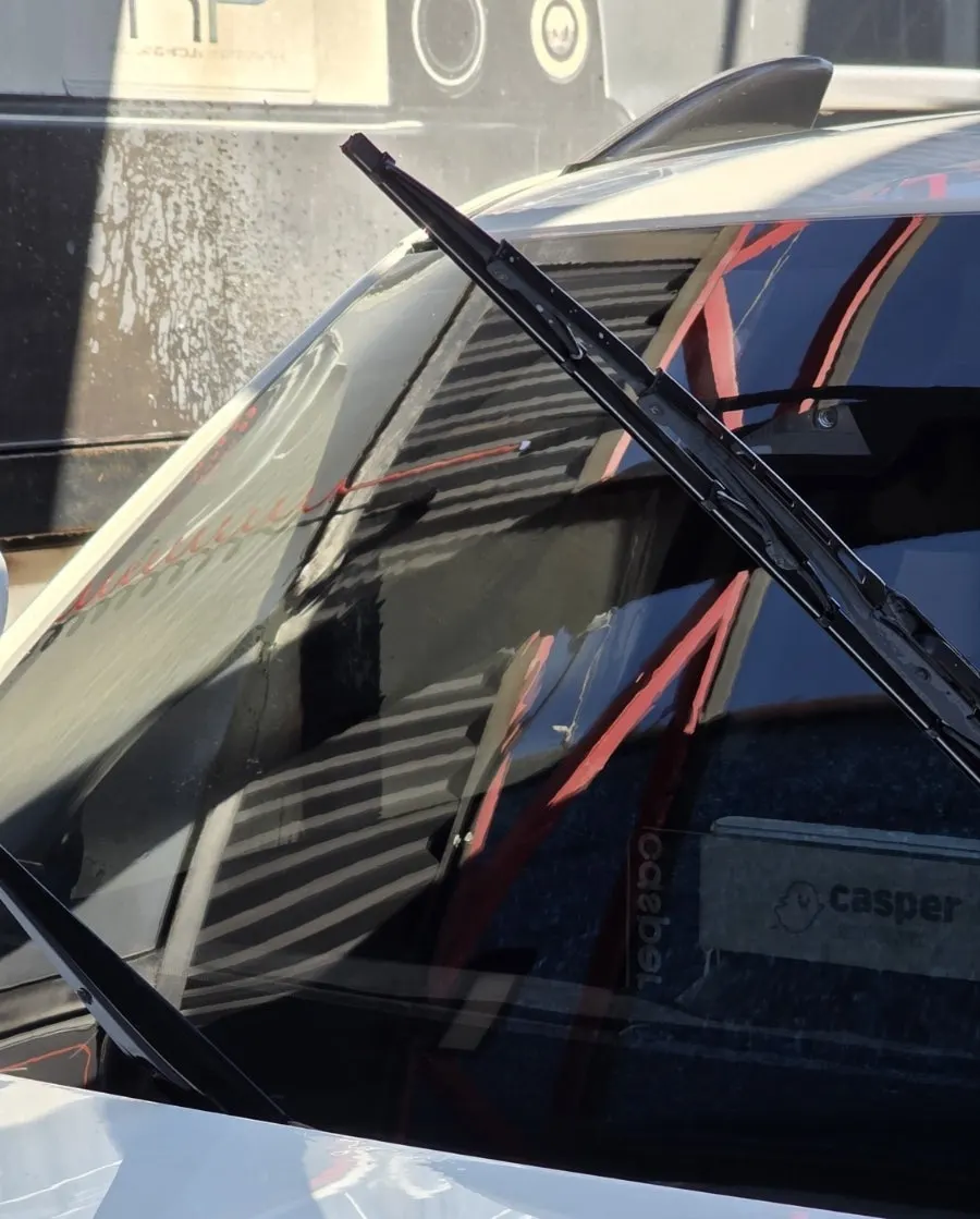 Car windshield after repeated rubbing with oil film remover