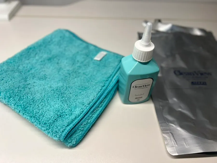 AutoGrooming oil film remover solution and dedicated towel