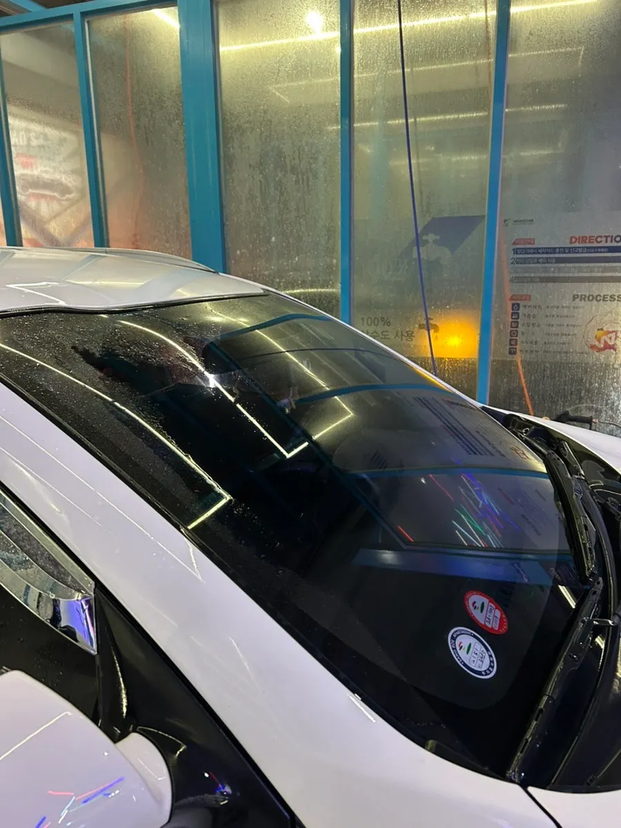 Washing a car before using oil-film remover