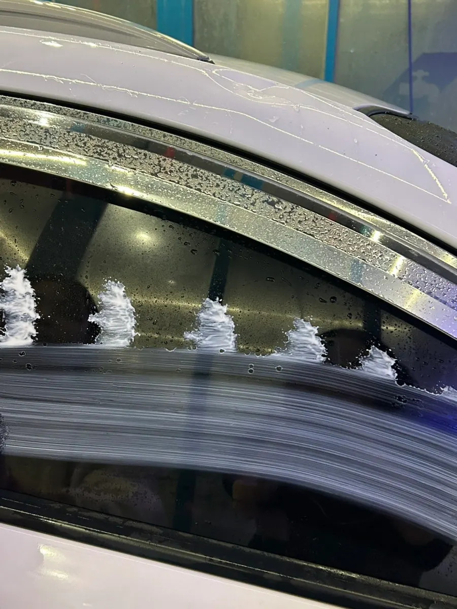 Towel covered with oil-film remover for applying to car glass