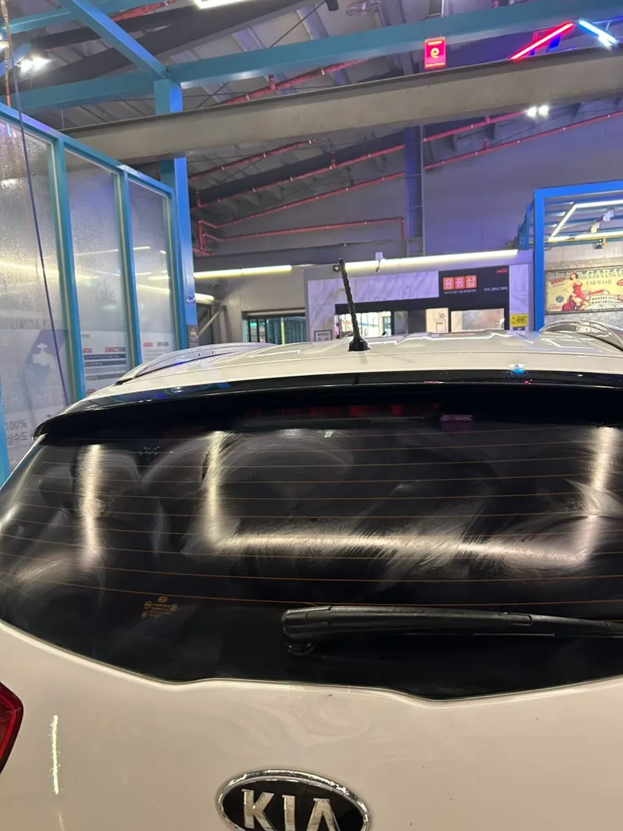 Wiping car glass with applied oil-film remover