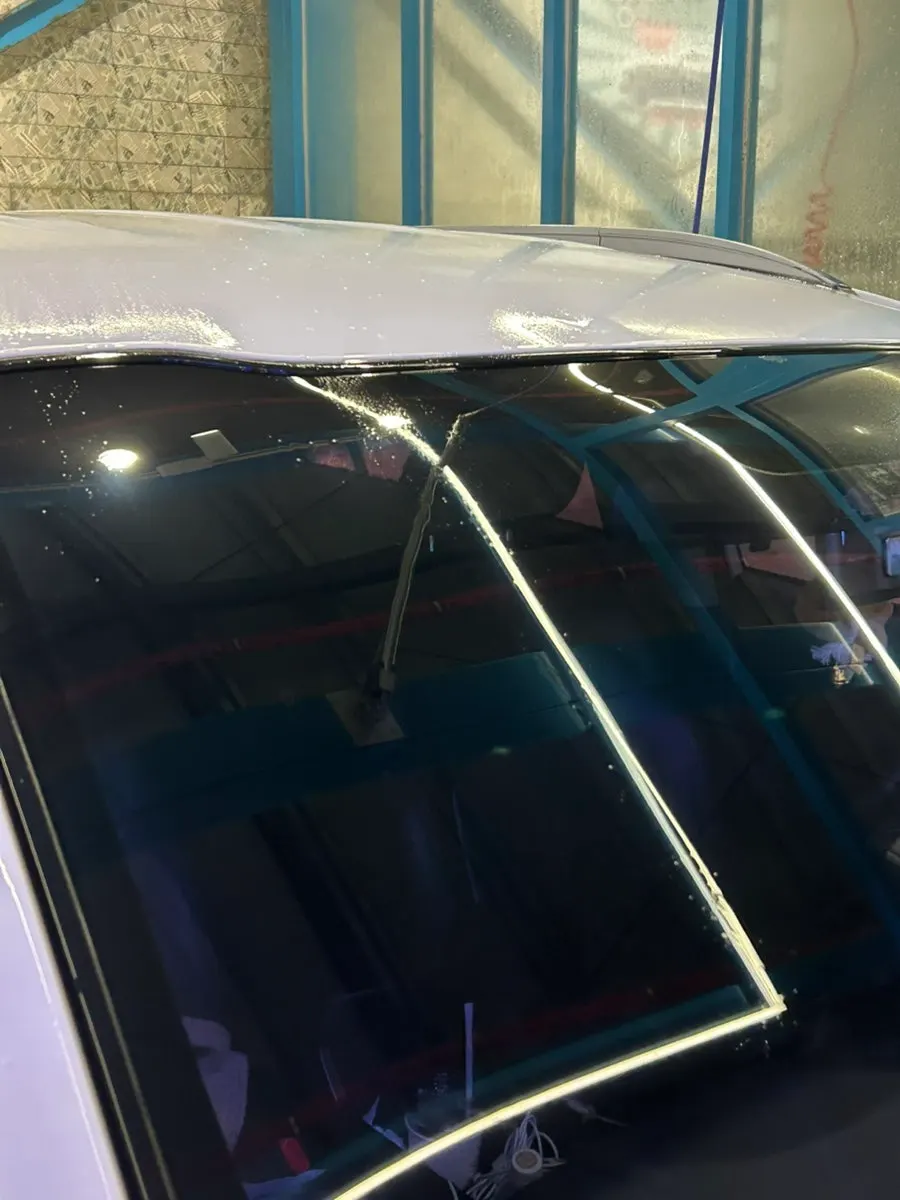 Car glass rinsed with water after using oil-film remover