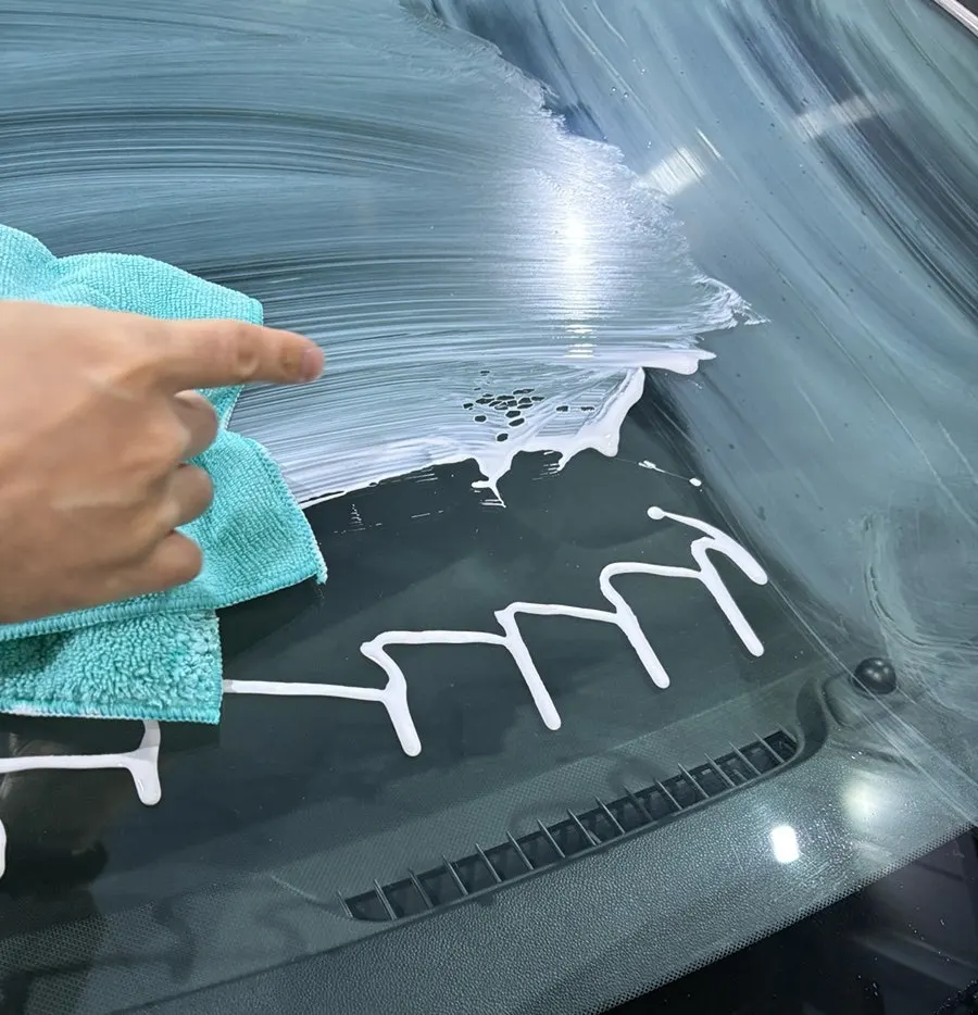 Car window with oily film before applying the product