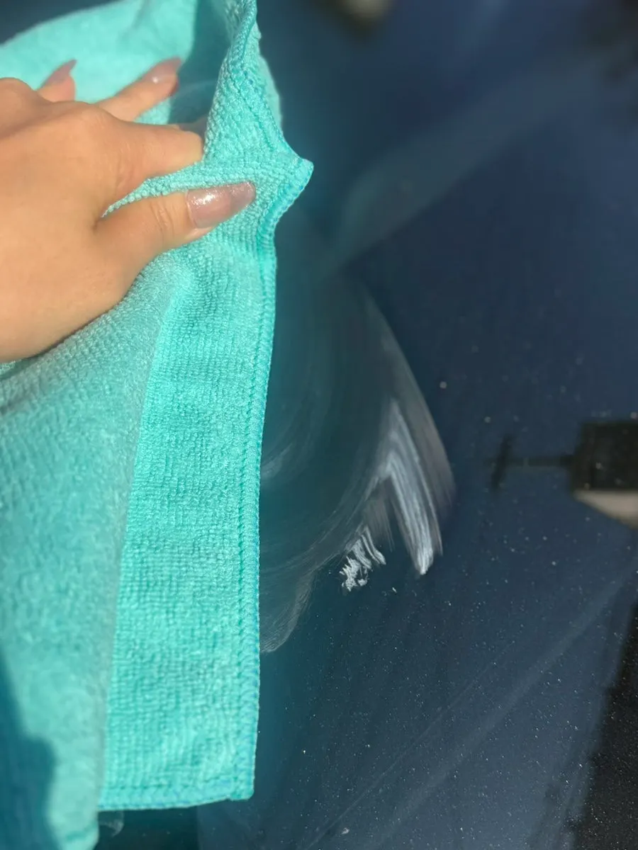 Managing water marks and oil film on bathroom glass surfaces