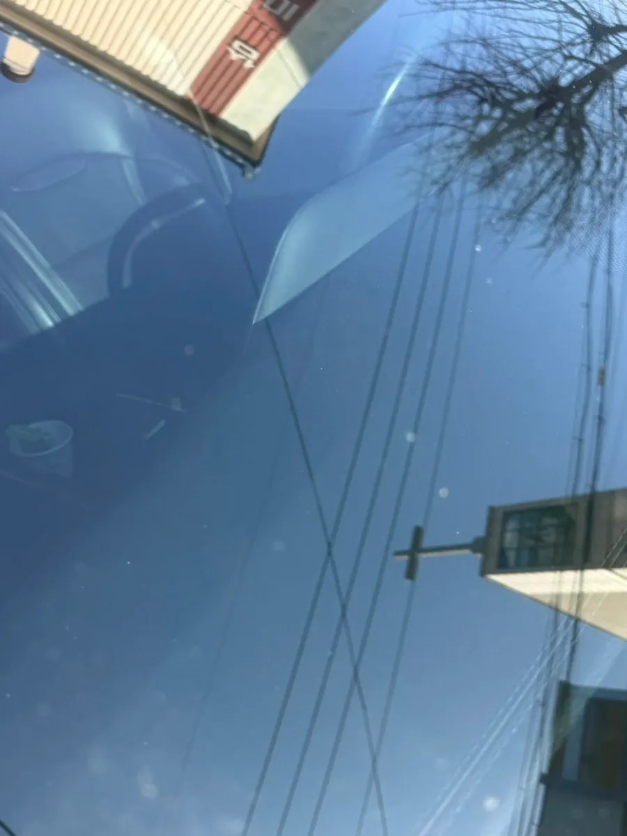 Glass care using AutoGrooming oil film remover