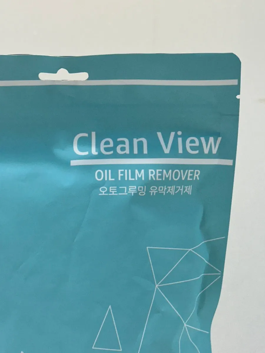 Cleaning a shower booth with a car glass film remover