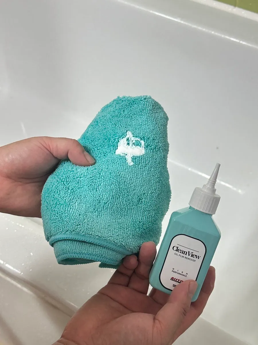 Preparing to clean by applying glass film remover to the dedicated towel