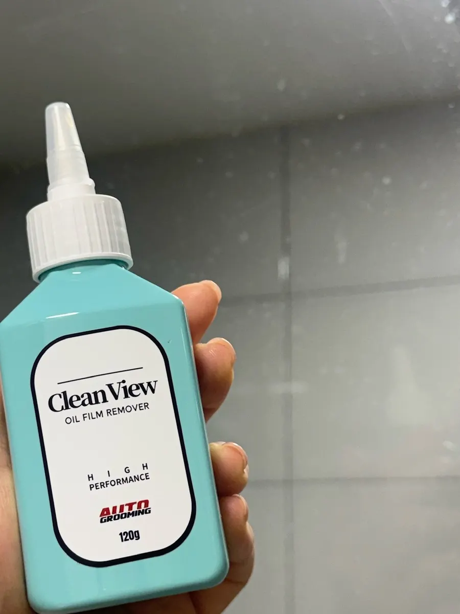 Shower-booth glass with remaining water spots and stains