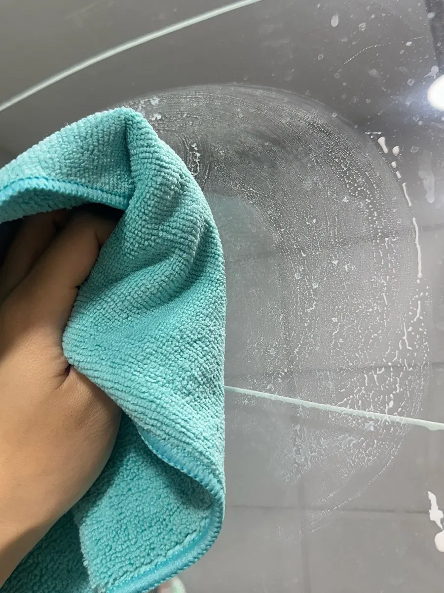 Shower-booth glass before oil-film removal