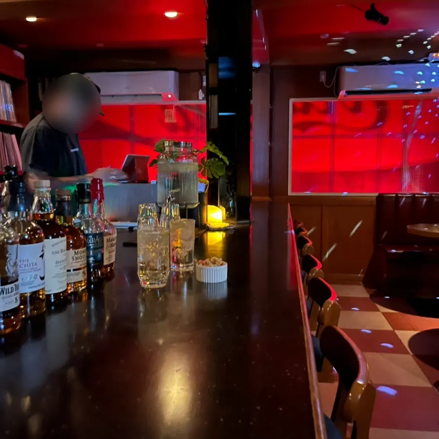 Inside the bar at CMS Soundbar making a highball