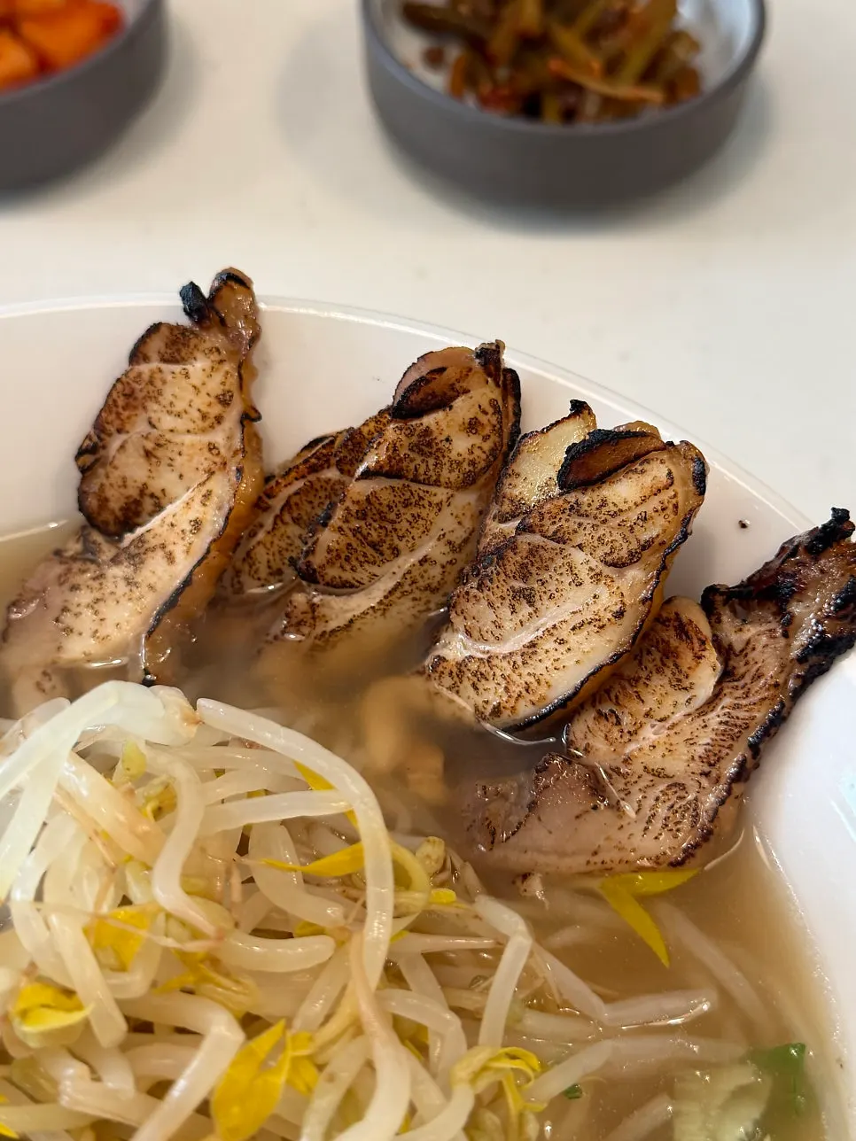 Bowl of chicken char siu ramyeon topped with char siu