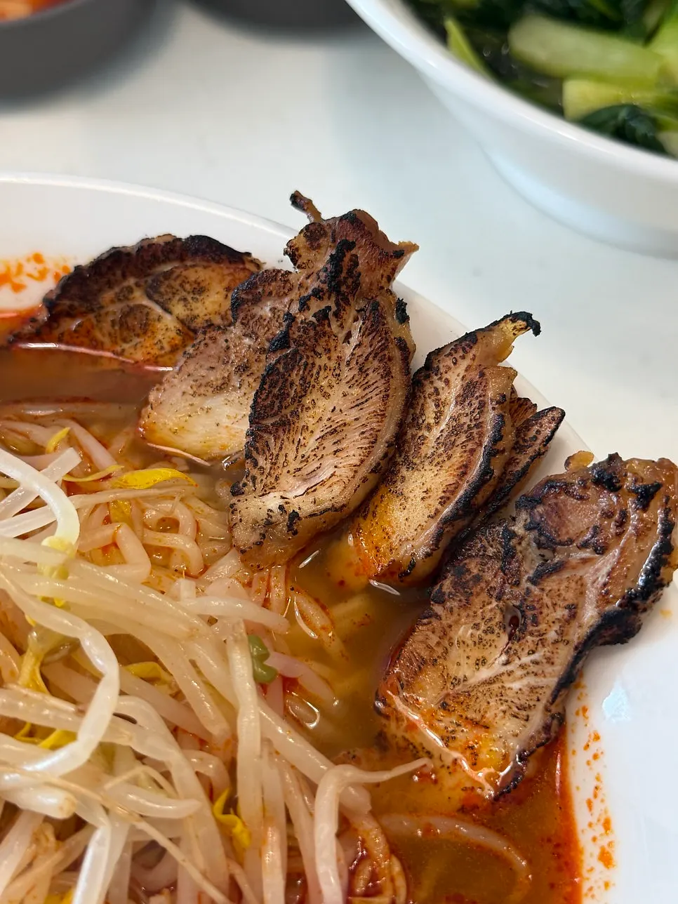 Bowl of spicy char siu ramyeon