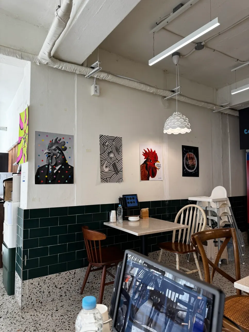 Exterior of Cocker Noodle Two with rooster character posters