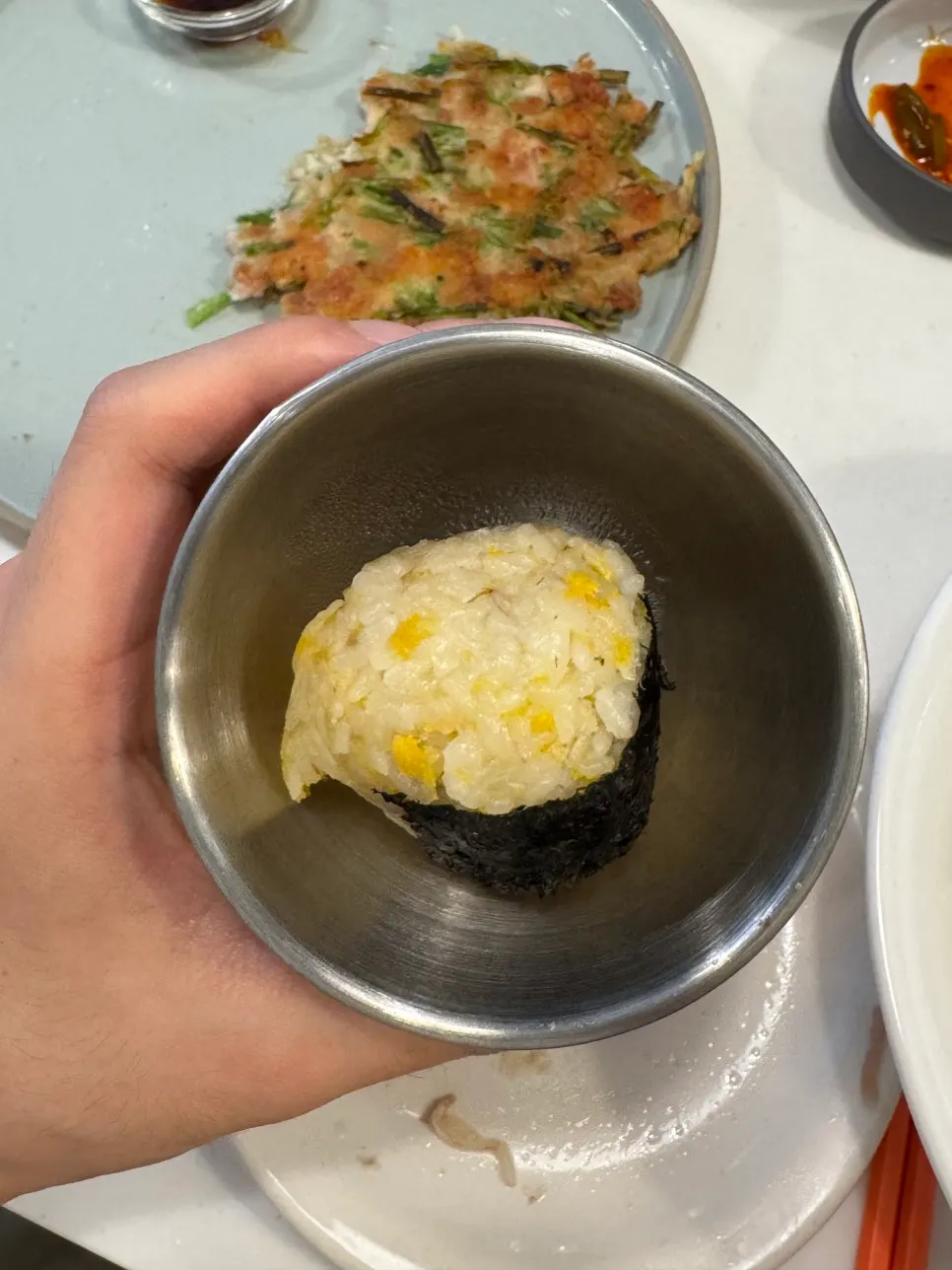 Egg rice ball served alongside the ramen
