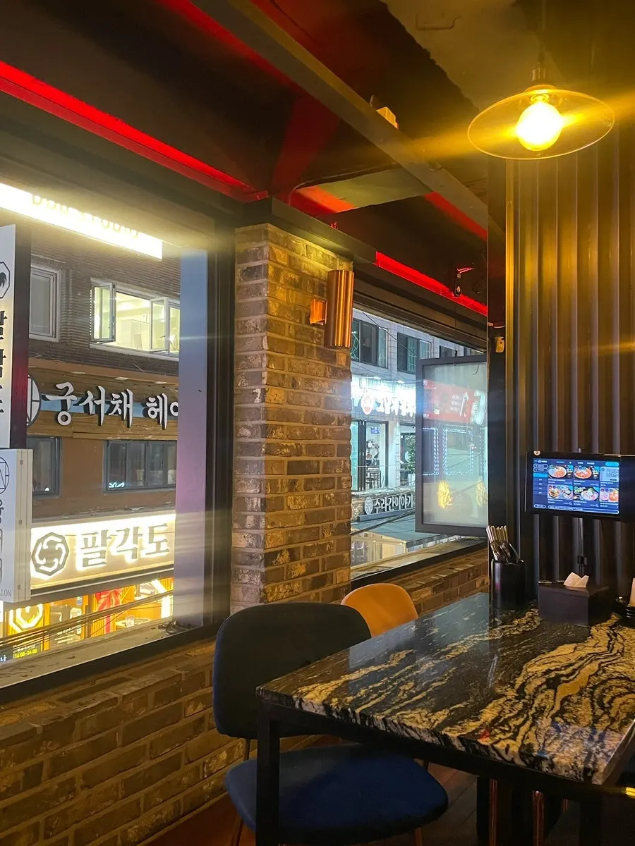 Interior view of the shop with the screen visible