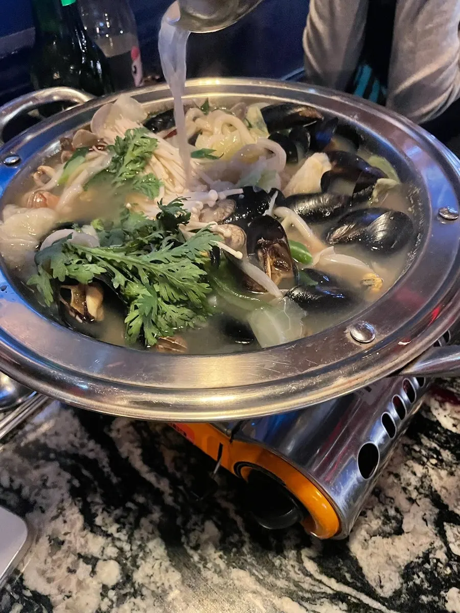 A pot of mussel and clam soup