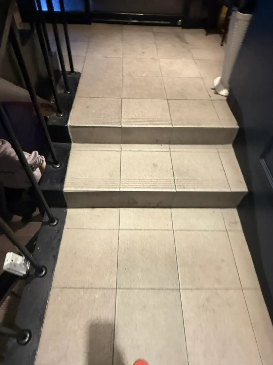 Entrance sign and staircase leading to Coco's