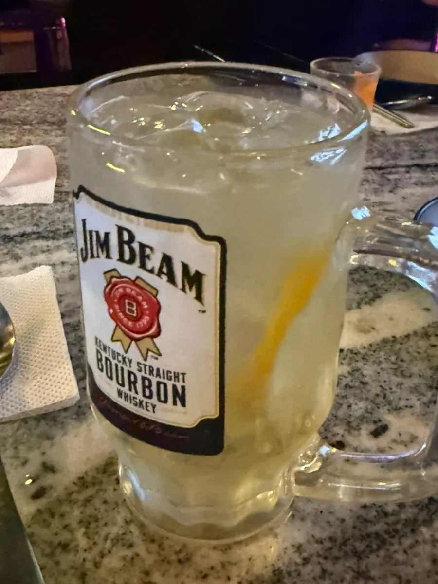 A Jim Beam highball glass filled with ice