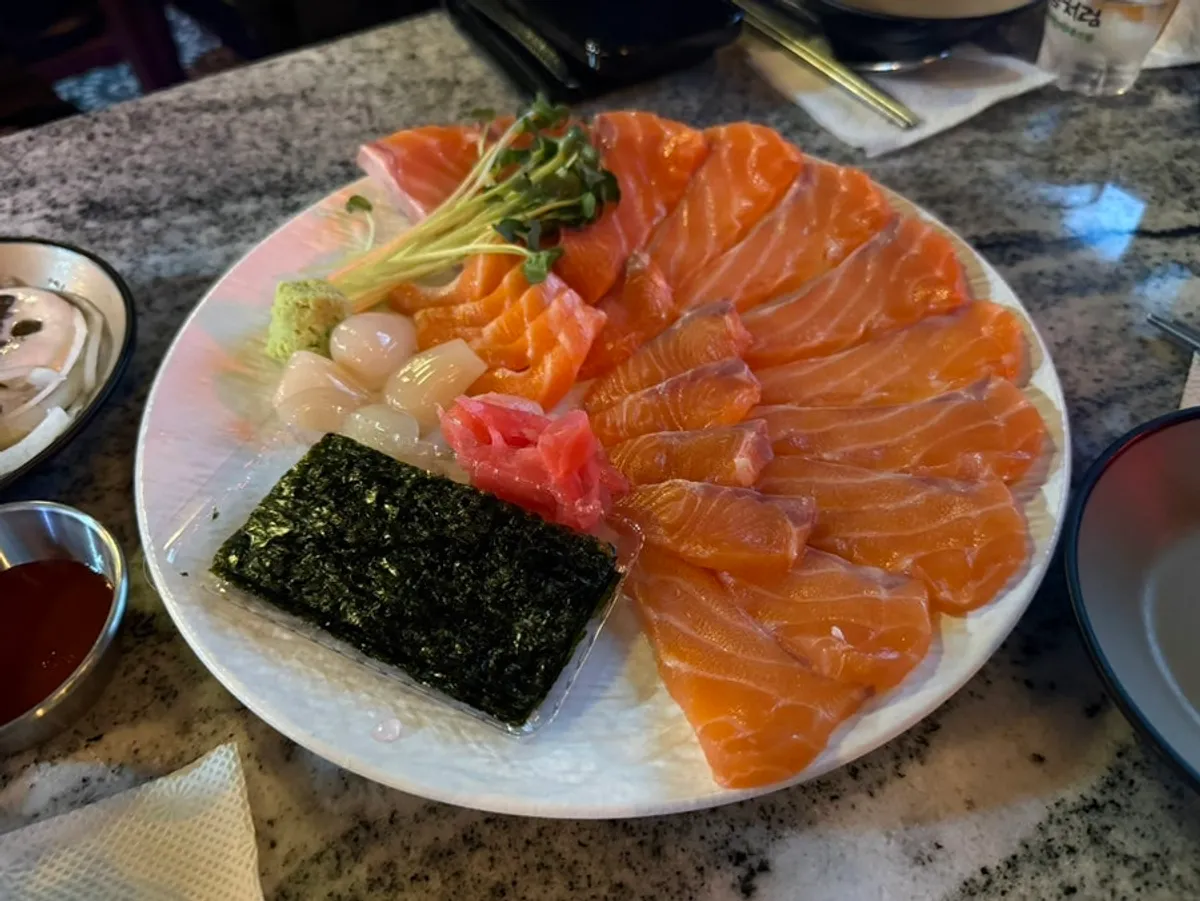 A glistening plate of aged salmon sashimi