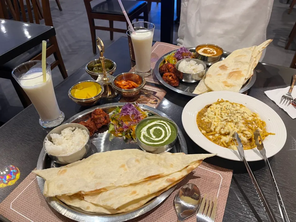 Table with two 1-Person A Sets and a lamb curry pasta