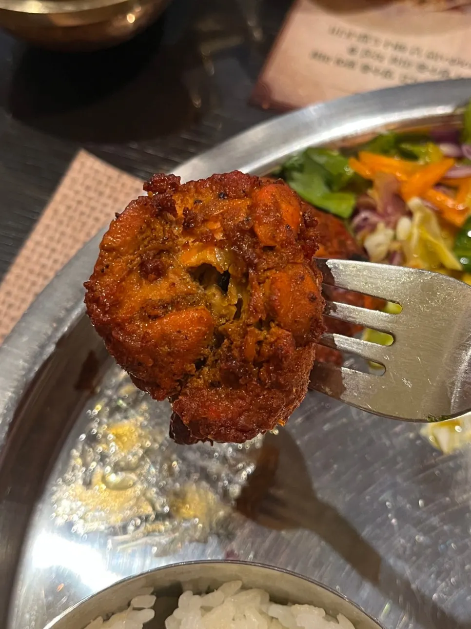 Two pieces of chicken tikka served in the 1-person set