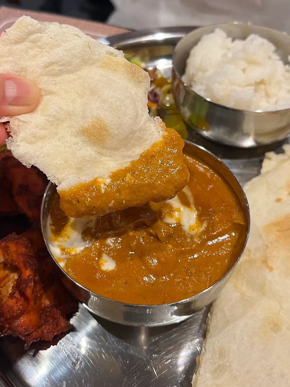 Pieces of chicken inside the chicken makhani