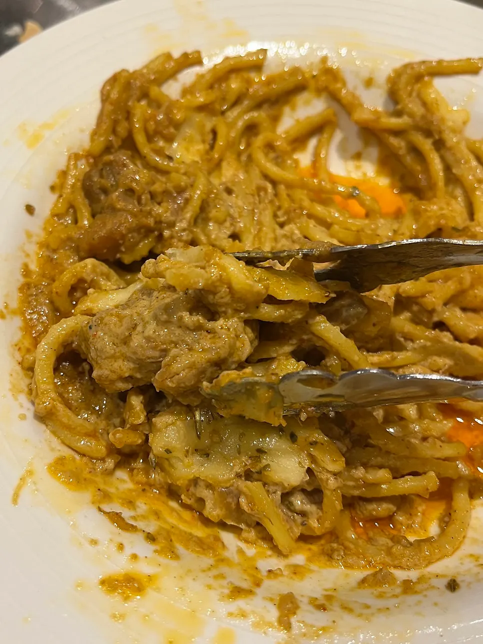 Pasta noodles soaked in curry sauce