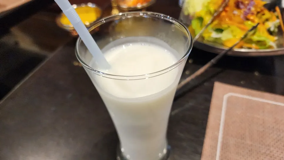 A glass of lassi included in the set